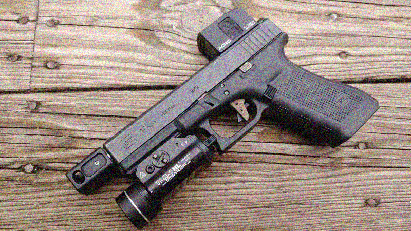  What does a compensator do on a pistol?